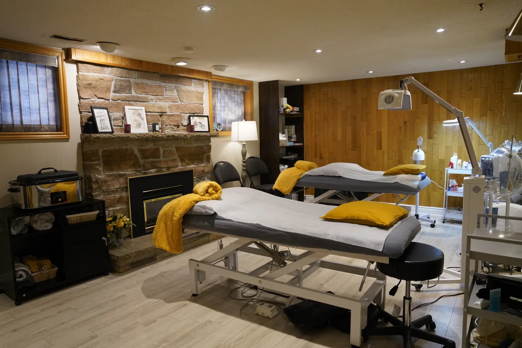 Rosegol treatment room interior with wood paneling and professional massage table